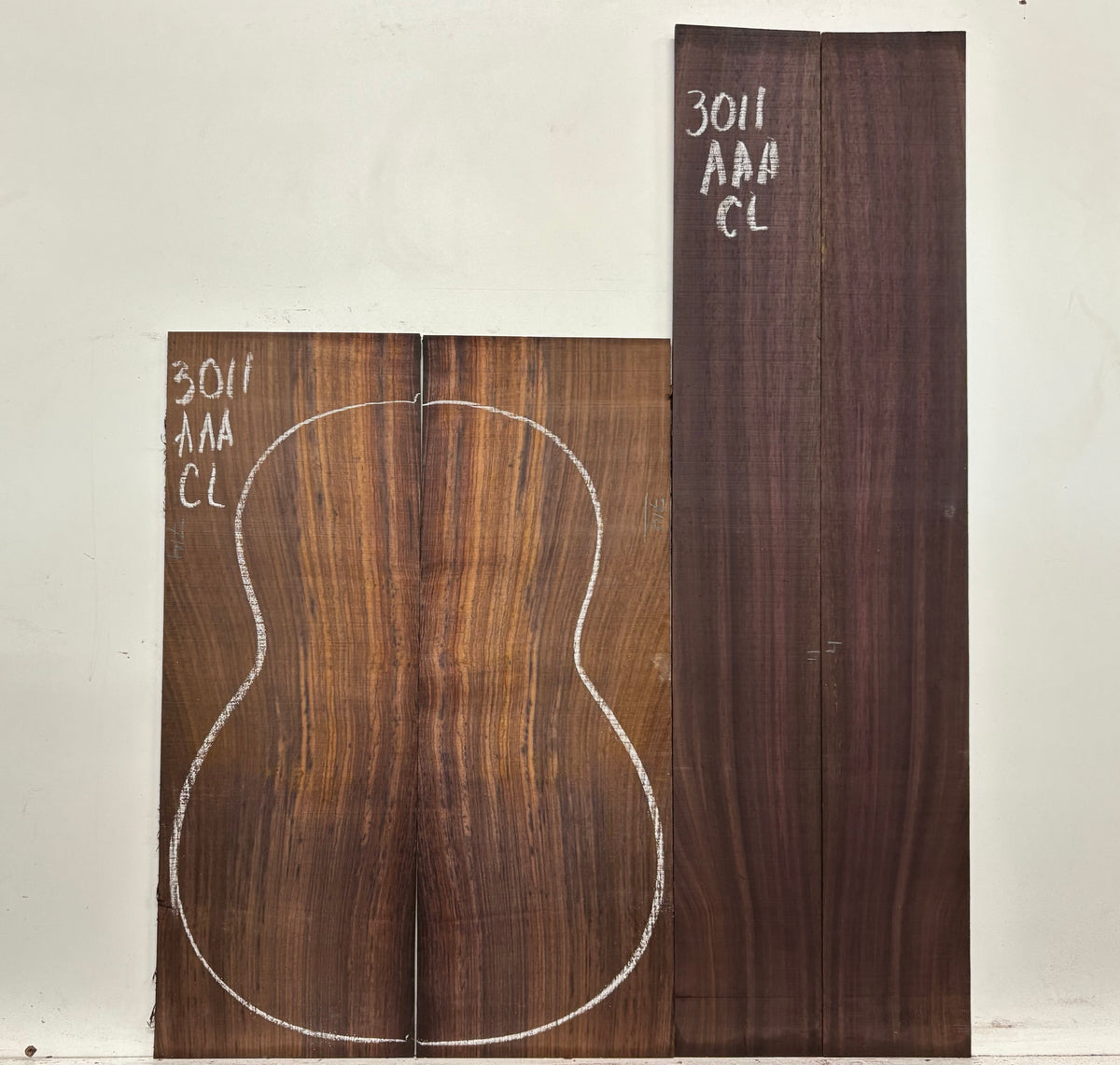 Two wooden panels with a guitar back design and measurements on a white background