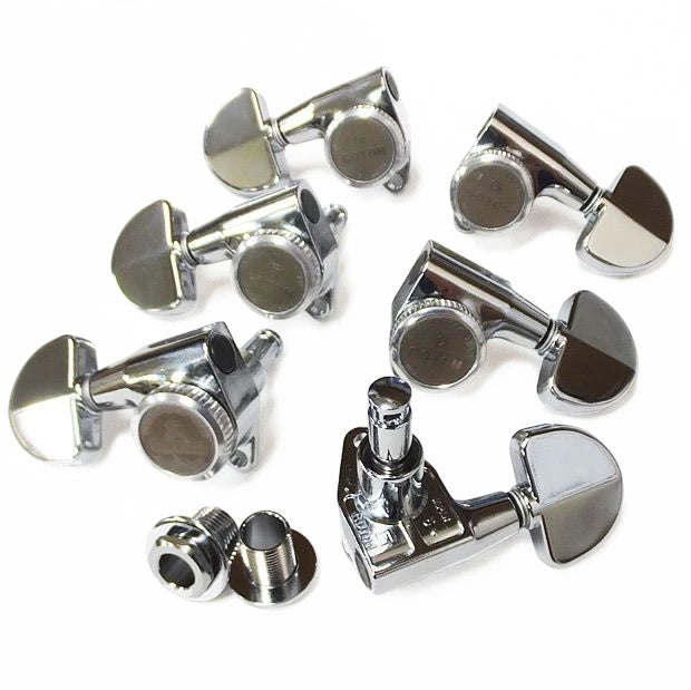 Set of chrome guitar tuners on a white background